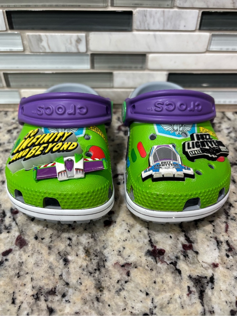 CROCS Toy Story Buzz Lightyear Kids Clogs in Bright Green and Purple